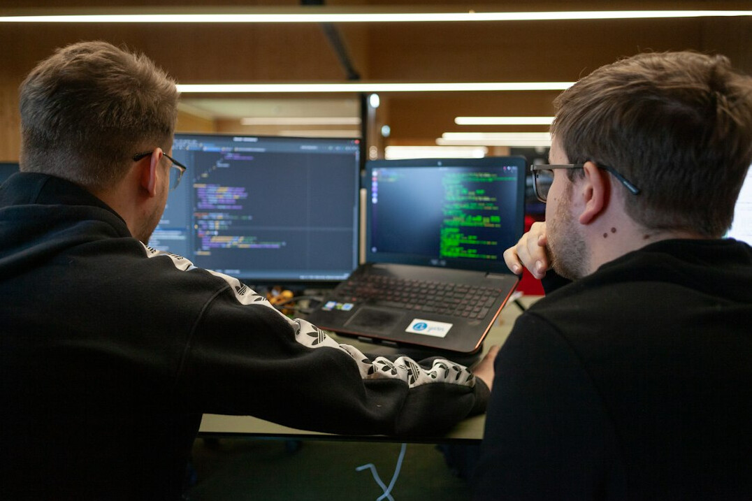 software developers coding together