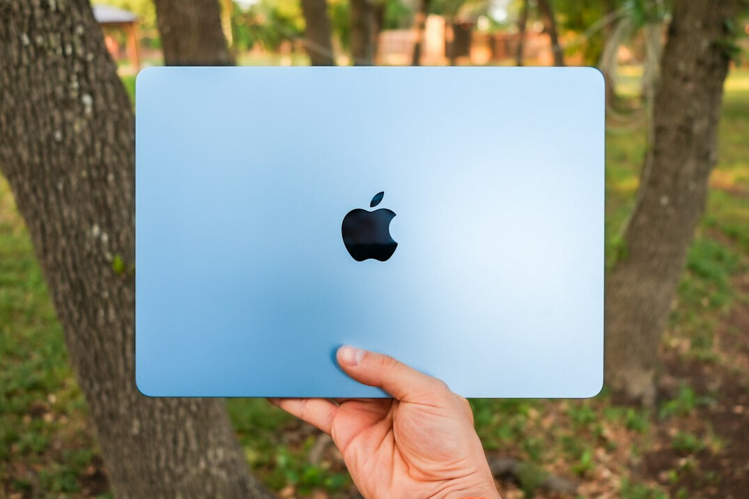 Open laptop and notebook on a desk